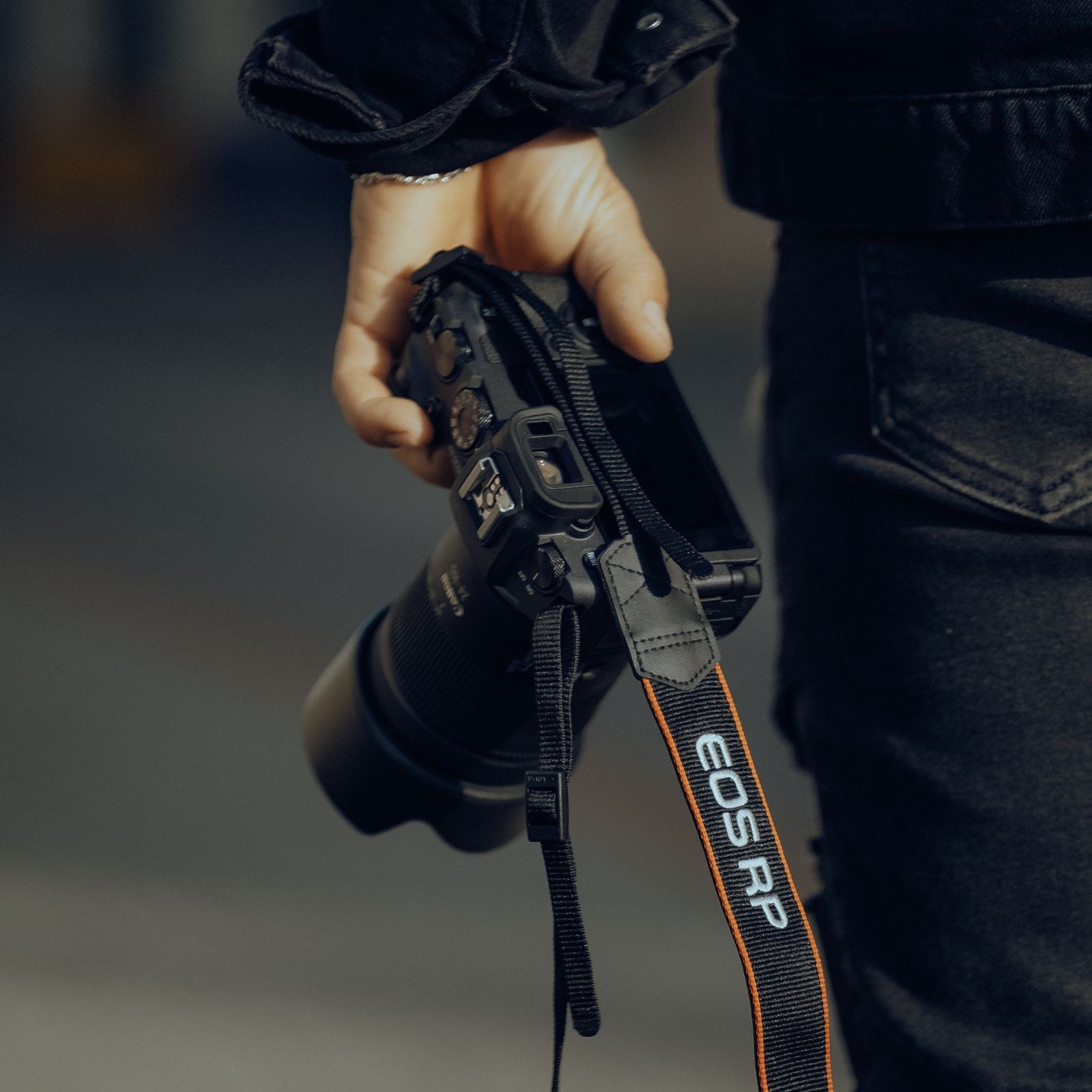 Editor framing a shot with a camera on location